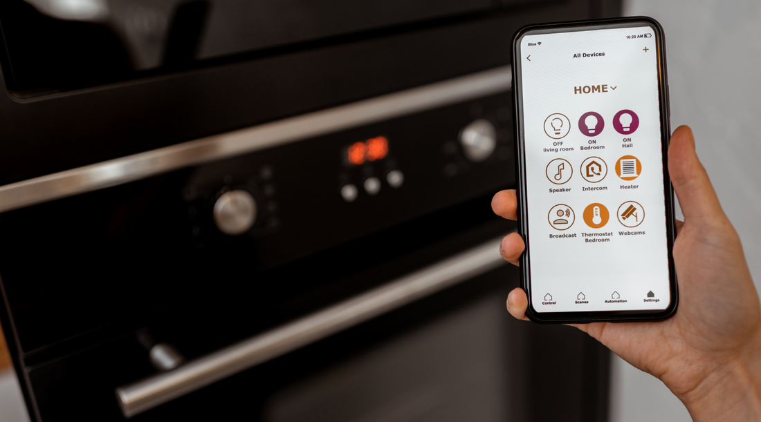 A person holding an iphone next to an oven showing apps relating to the kitchen.
