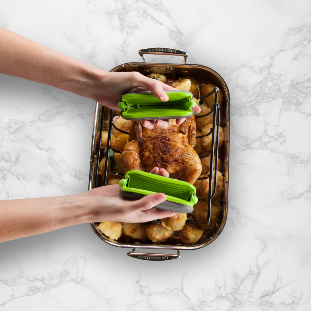 PebbleGrip in Green being used to move a roast chicken.